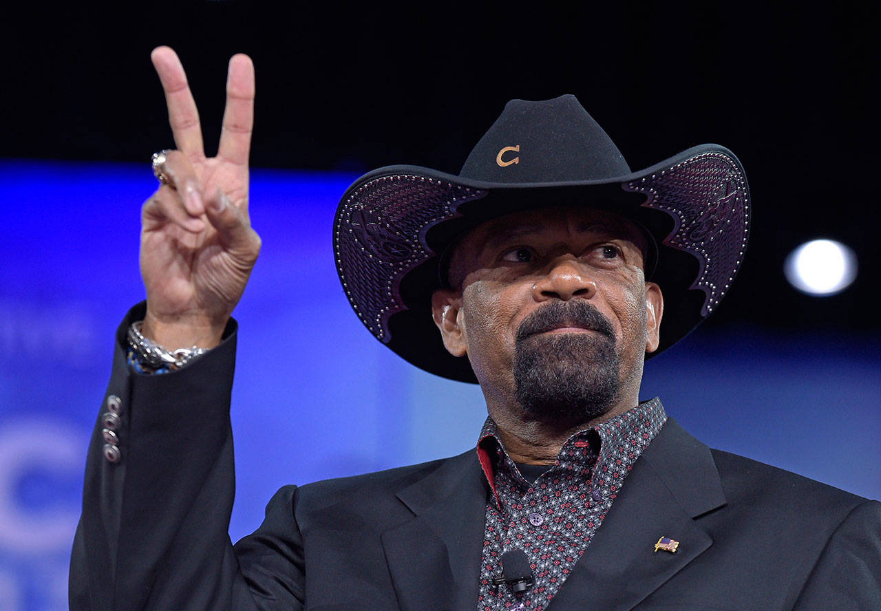 Milwaukee County Sheriff David Clarke speaks at the Conservative Political Action Conference (CPAC) in Oxon Hill, Md., in this Feb. 23, 2017, file photo. The former Milwaukee Sheriff’s run-in with a man who shook his head at him while boarding a flight last year is headed for trial in federal court Monday, Jan. 22, 2018. (AP Photo/Susan Walsh File)