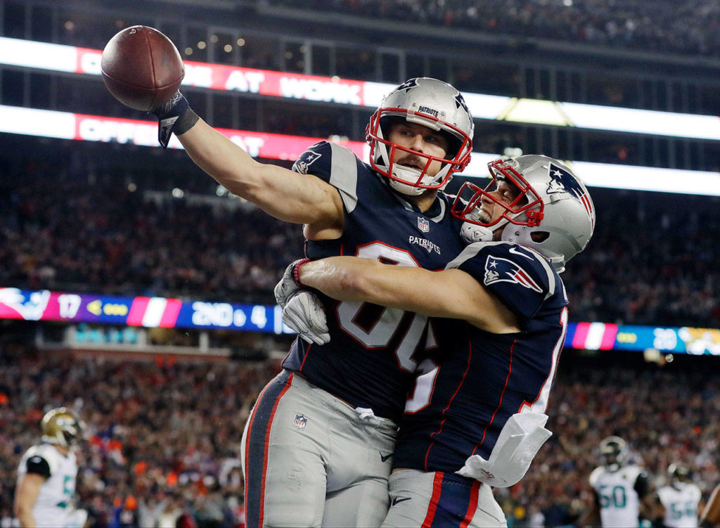 New England Patriots wide receiver Danny Amendola, left, celebrates his touchdown catch with Chris Hogan, right, during the second half of the AFC championship NFL football game against the Jacksonville Jaguars, Sunday, Jan. 21, 2018, in Foxborough, Mass. (AP Photo/David J. Phillip)

