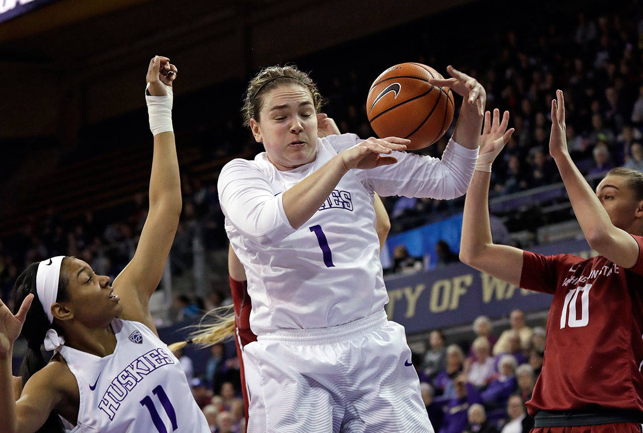 Washington junior forward Hannah Johnson (1) grabbed a career-high 17 rebounds Sunday in the Huskies’ 56-49 victory over Washington State. (AP Photo/Elaine Thompson)