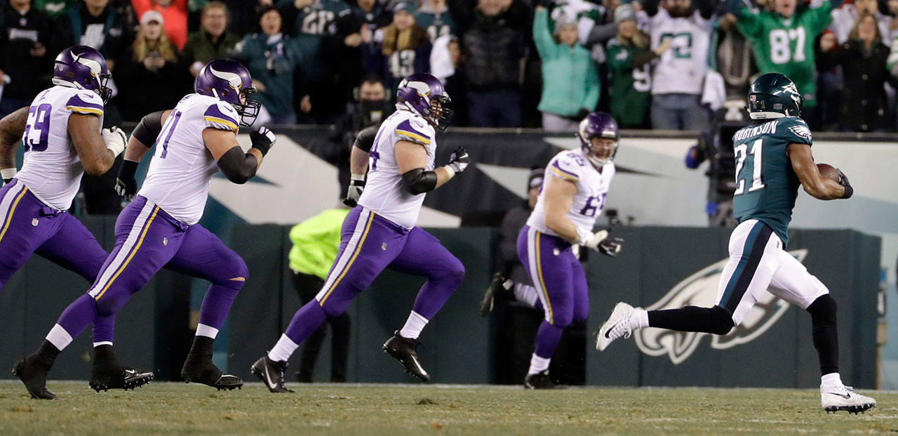 Philadelphia’s Patrick Robinson runs back an interception for a touchdown during the first half of the NFC championship game against the Minnesota Vikings on Sunday in Philadelphia. (Matt Slocum / Associated Press)