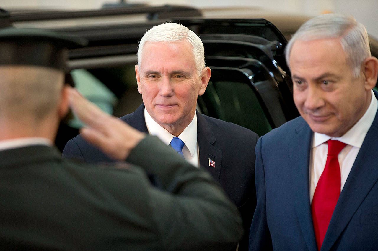 U.S. Vice President Mike Pence walks with Israeli Prime Minister Benjamin Netanyahu in Jerusalem on Monday. (AP Photo/Ariel Schalit)