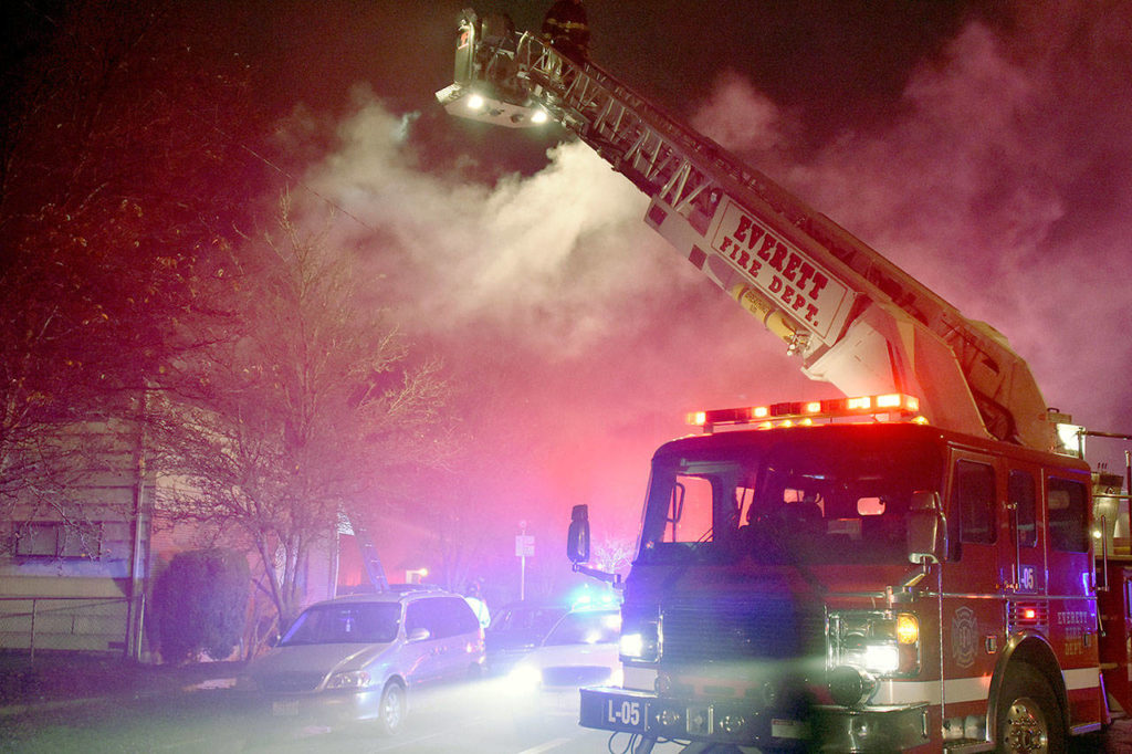 The fire at the Colby Square apartment building in Everett on Dec. 21 left one woman dead. (Caleb Hutton / The Herald)
