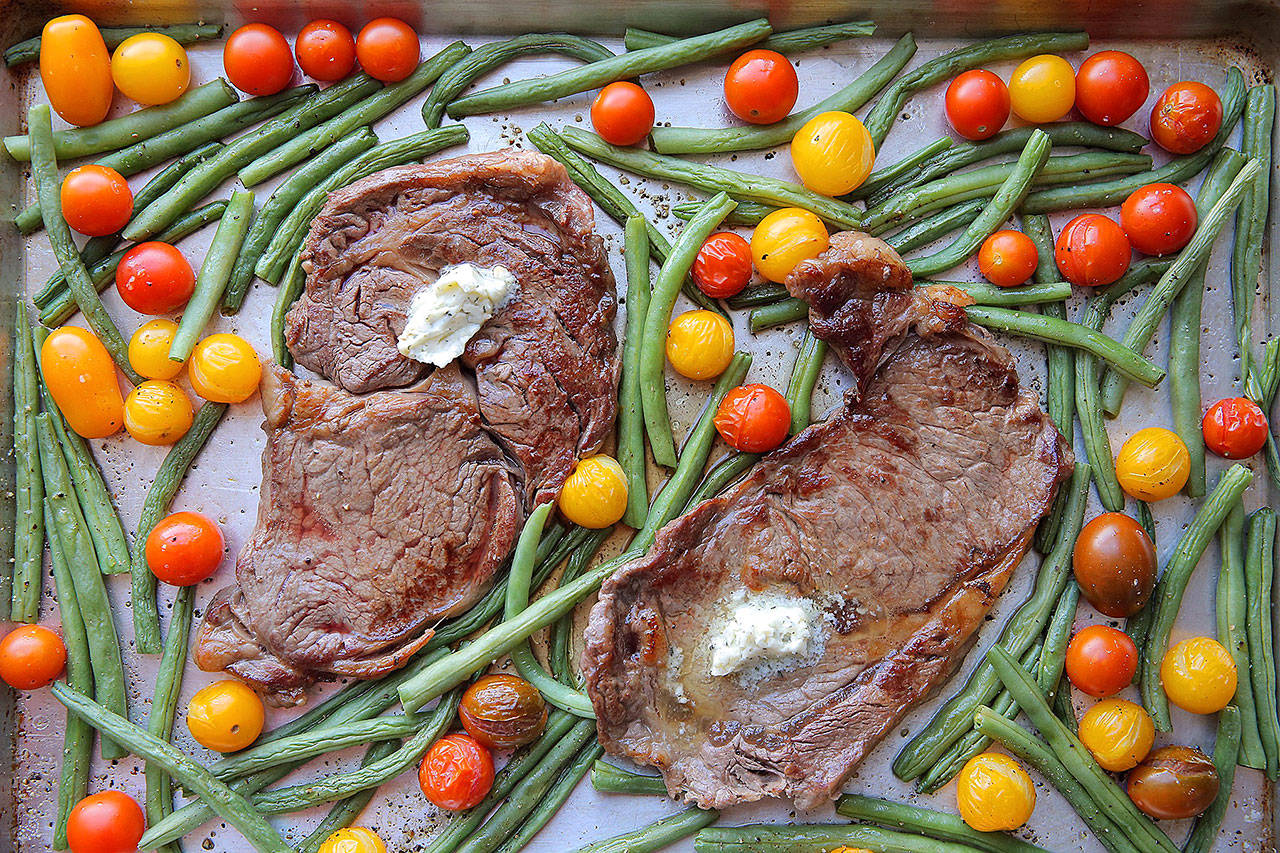 You can broil rib eyes with veggies and blue-cheese butter all on the same sheet. (Cristina M. Fletes/St. Louis Post-Dispatch)