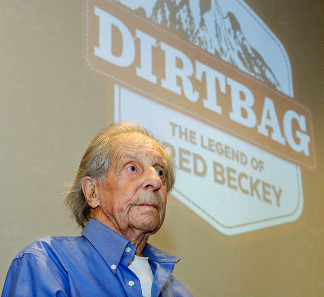 Legendary mountain climber Fred Beckey sits in front of a screen bearing the logo for “Dirtbag: The Legend of Fred Beckey” in July 2016. Beckey died on Oct. 30, 2017. (Ted S. Warren / Associated Press)