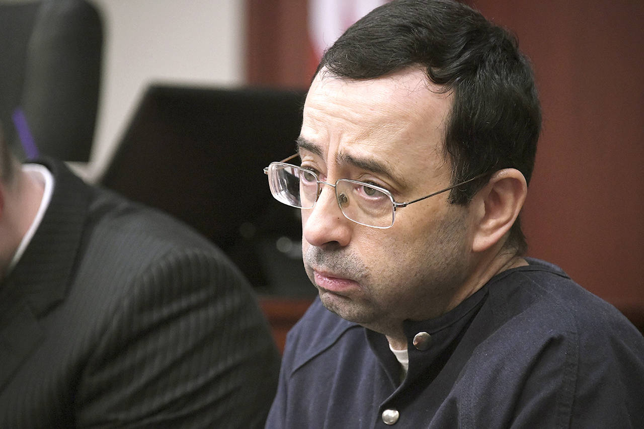 Larry Nassar looks at the gallery in the court during the sixth day of his sentencing hearing Tuesday in Lansing, Michigan. Nassar has admitted sexually assaulting athletes when he was employed by Michigan State University and USA Gymnastics, which is the sport’s national governing organization and trains Olympians. (Dale G.Young/Detroit News via AP)