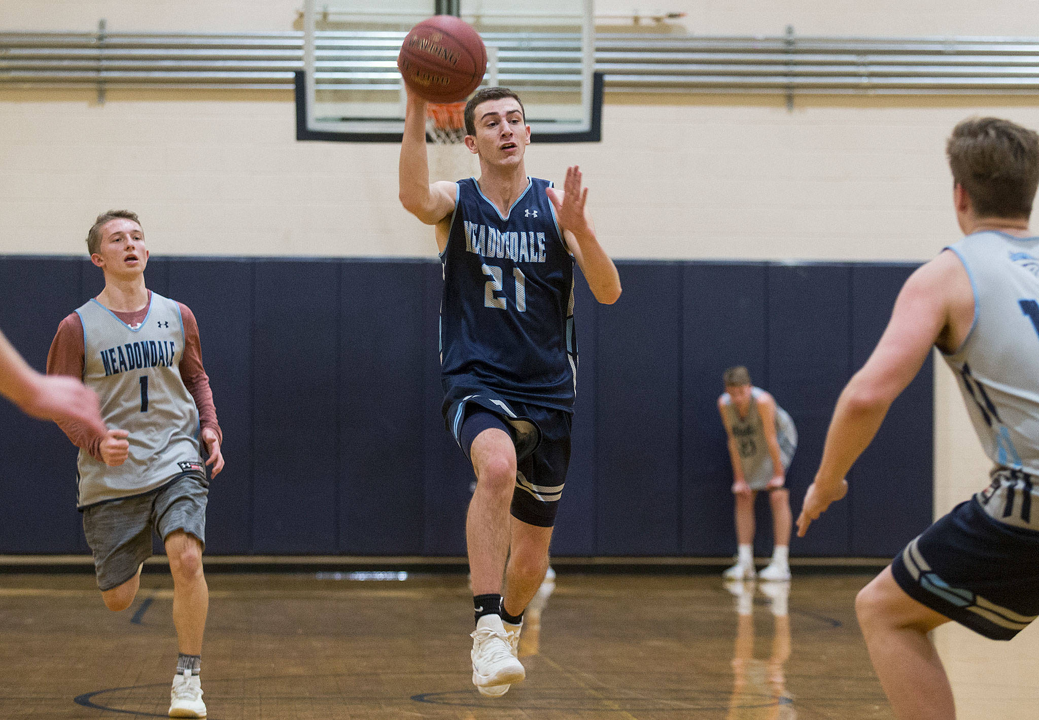 Meadowdale High School’s Dan Barhoum leads a fast break during a team practice Wednesday in Lynnwood. (Andy Bronson / The Herald)