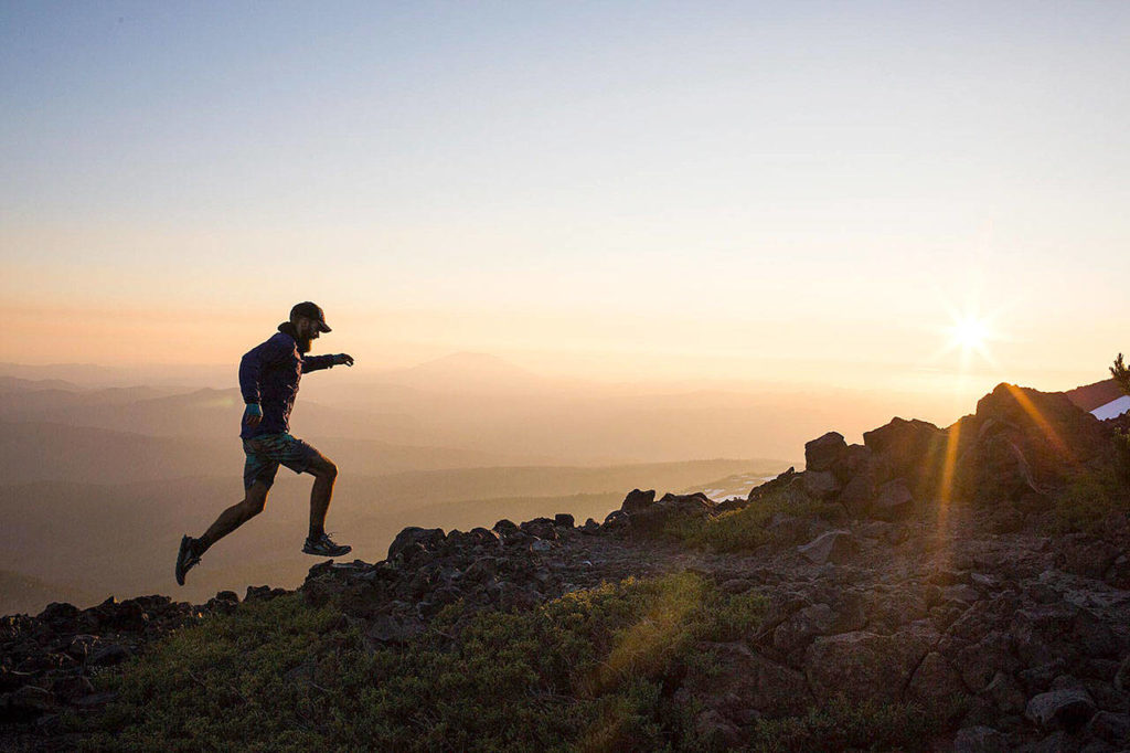 Hikers in Action, first place: This photo of a man running along the rocks at Mount Adams by Sofia Jaramillo won top honors in the Hikers in Action category.
