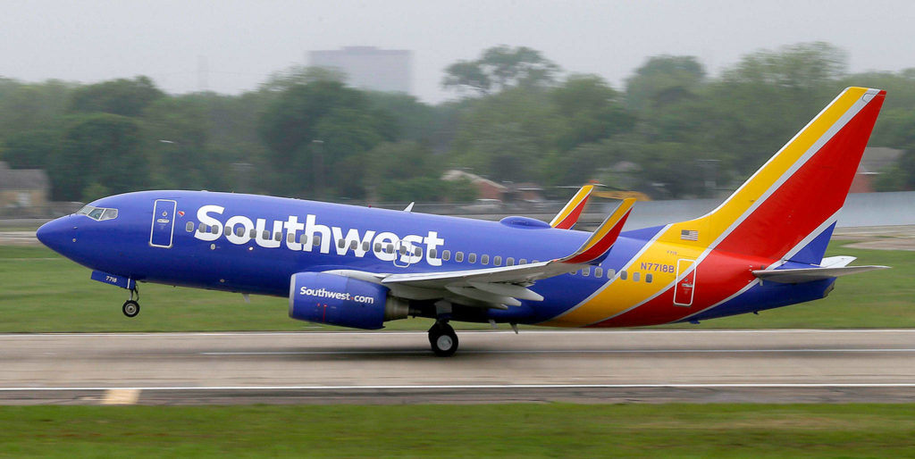 A Southwest Airlines Boeing 737 takes off from a runway at Love Field in Dallas. (AP Photo/LM Otero, File) 
