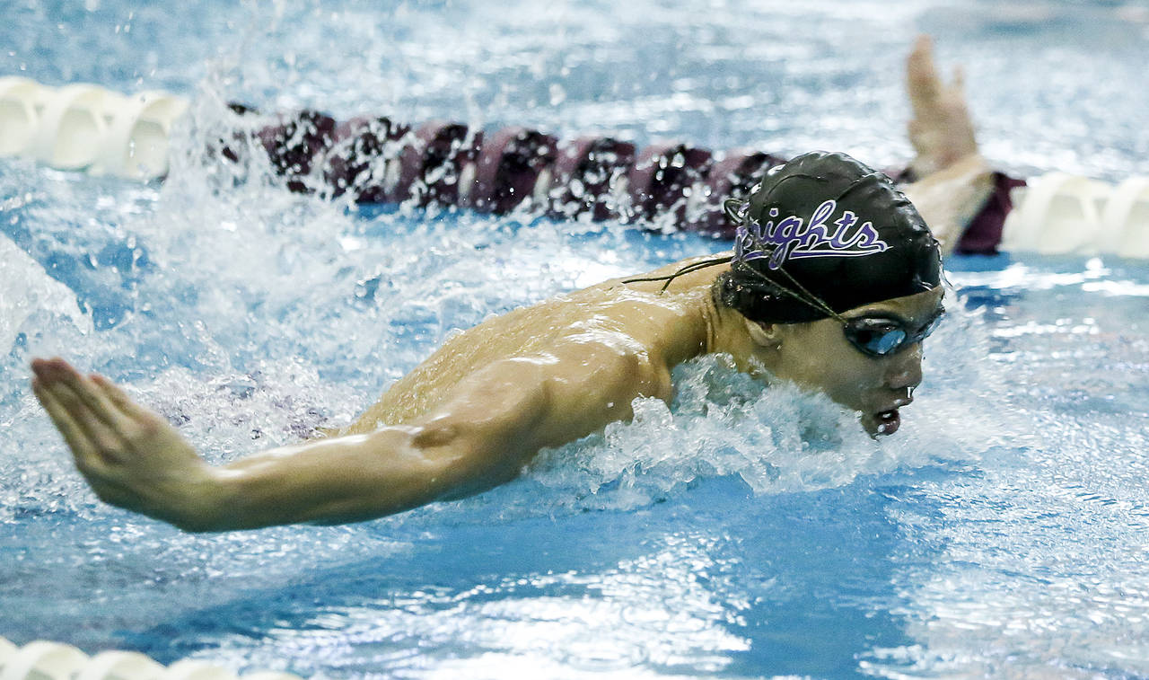 Kamiak’s Maxwell Fang swims to victory in the 100 butterfly during a meet against Jackson at Kamiak High School in Mukilteo on Thursday, Jan. 25. (Ian Terry / The Herald)