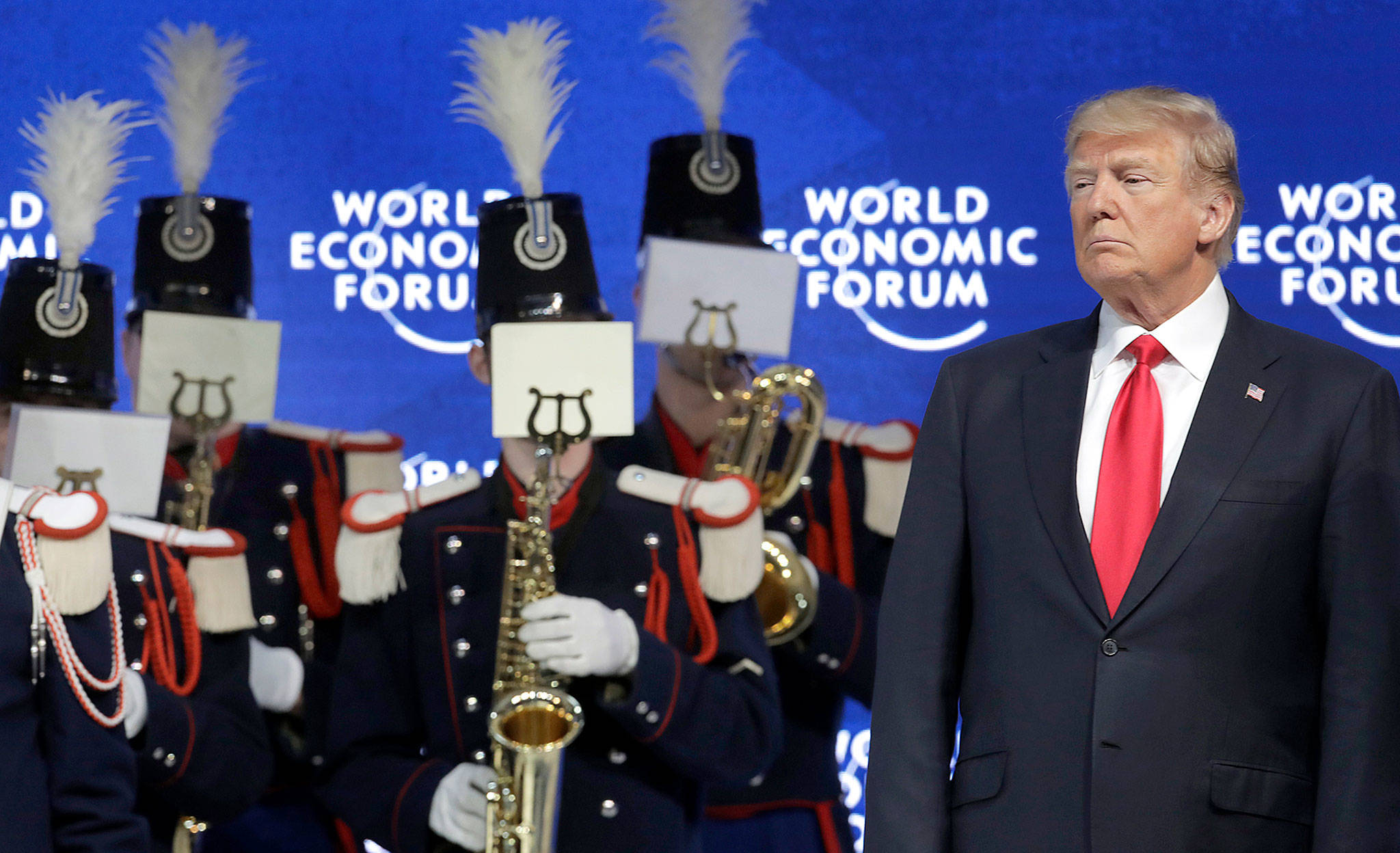 U.S. President Donald Trump (right) attends a music performance prior to his speech during the annual meeting of the World Economic Forum in Davos, Switzerland, on Friday. (AP Photo/Markus Schreiber)
