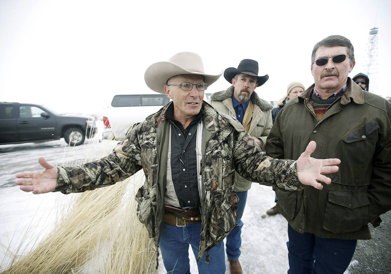 In this Jan. 9, 2016 photo, Robert “LaVoy” Finicum (left) a rancher from Arizona, talks to reporters at the Malheur National Wildlife Refuge near Burns, Oregon. (AP Photo/Rick Bowmer, File)