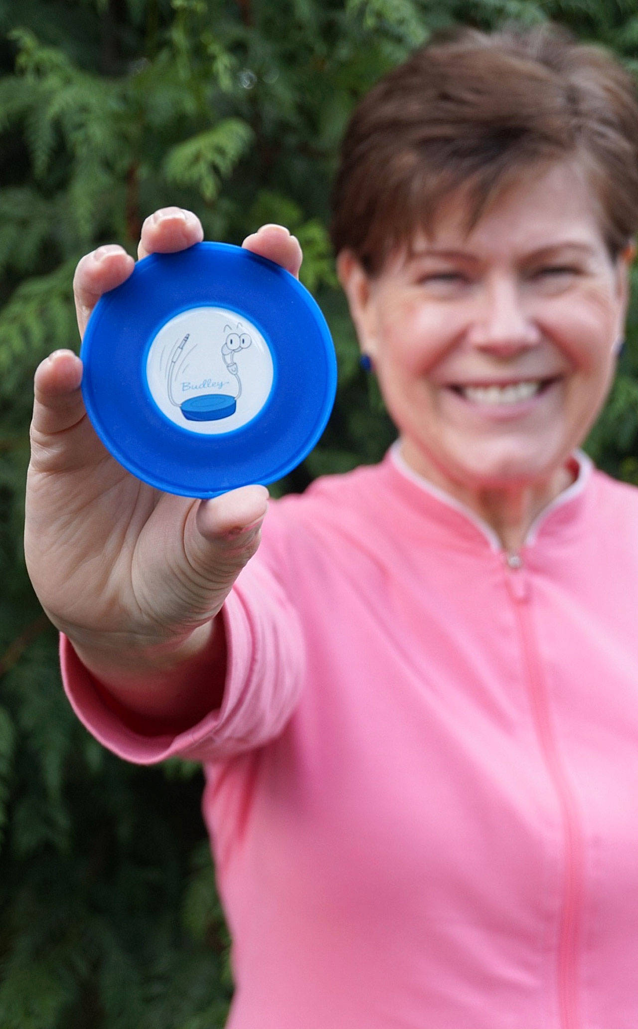 Budley co-inventor Katherine Burks holds the product. Budley helps keep headphones tidy, clean and untangled. (Contributed photo)                                Budley co-inventor Katherine Burks holds the product. Budley helps keep headphones orderly, clean and untangled. (Contributed photo)