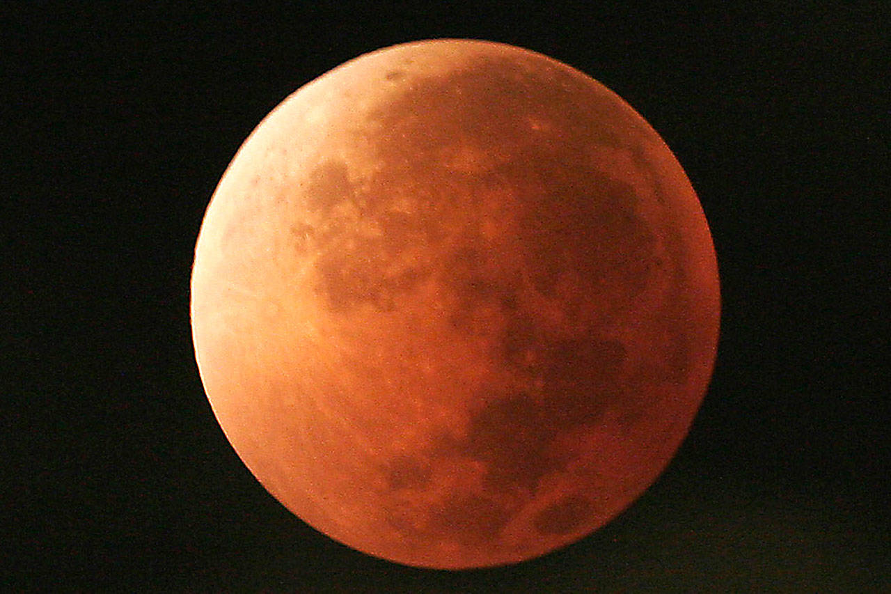 The moon takes on different orange tones during a lunar eclipse seen from Mexico City in 2007. (AP Photo/Marco Ugarte, File)