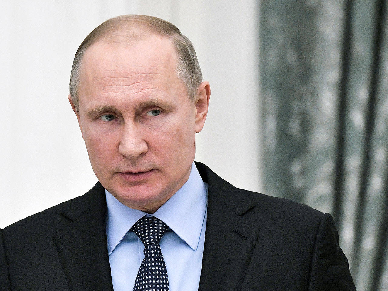 President Vladimir Putin attends the ceremonial signing of a general agreement between Russian trade unions, employers and the government in Moscow, Russia, on Monday. (Alexei Nikolsky, Sputnik, Kremlin Pool Photo via AP)