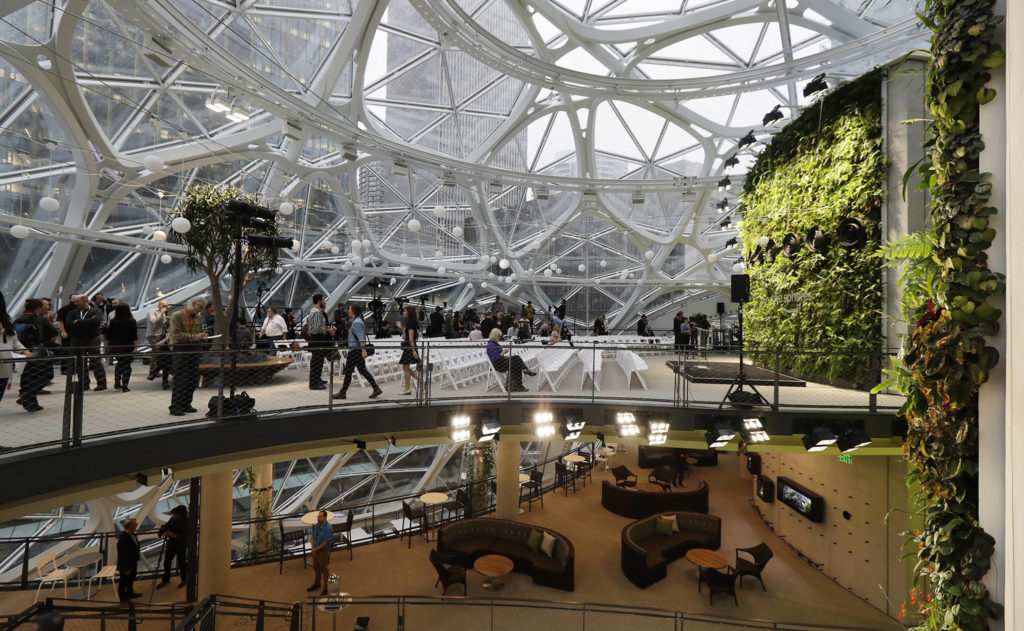 Gathering spaces and a plant-filled wall are shown before a grand opening ceremony for the Amazon Spheres on Mondayin Seattle. (AP Photo/Ted S. Warren)
