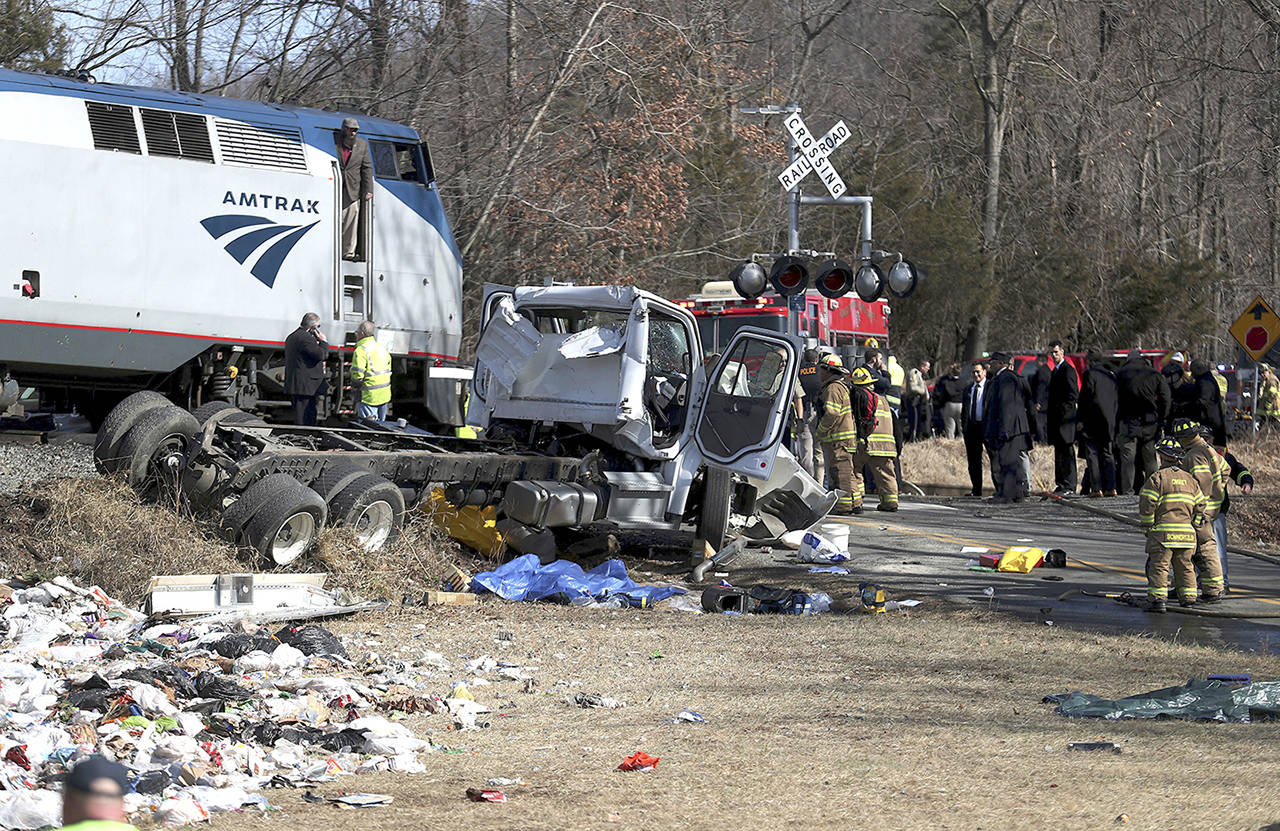 Emergency personnel work at the scene of a train crash involving a garbage truck and an Amtrak passenger train carrying dozens of GOP lawmakers south of Charlottesville, Virginia on Wednesday. (Zack Wajsgrasu/The Daily Progress via AP)