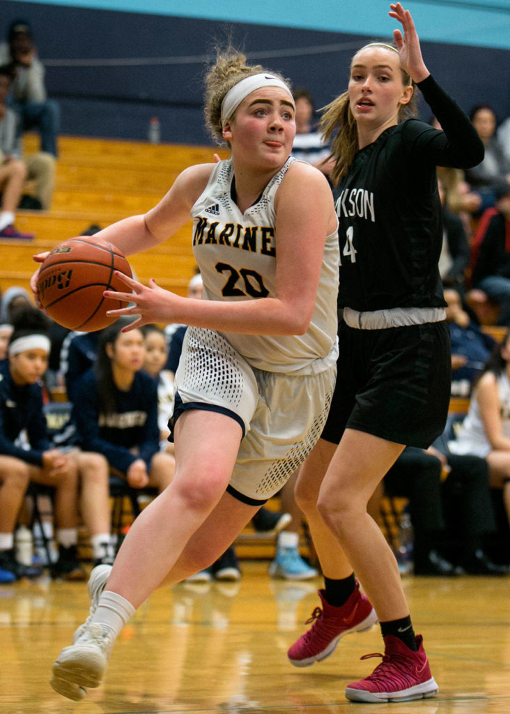 Mariner’s Taliyah Clark attempts a baseline drive with Jackson’s Alexa Martin defending Wednesday night at Mariner High School in Everett on January 31, 2018. (Kevin Clark / The Daily Herald)
