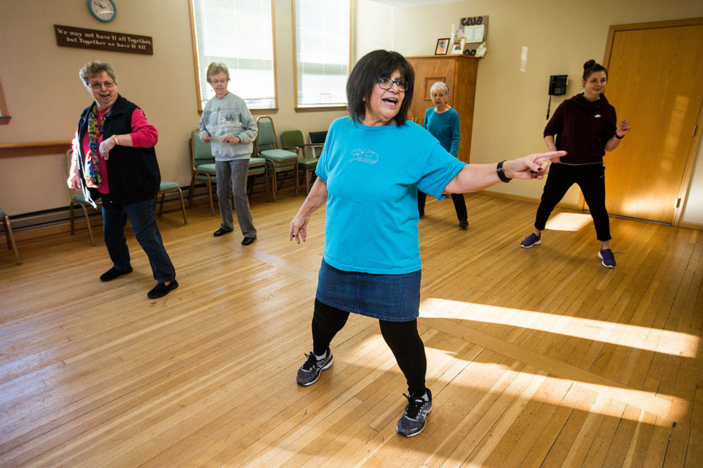 Lilia Smith, 62, a retired Boeing worker who teaches line dancing classes at the Stanwood Senior Center, lost 98 pounds, going from 270 to 172. She credits it to TOPS, Take Off Pounds Sensibly. (Andy Bronson / The Herald)
