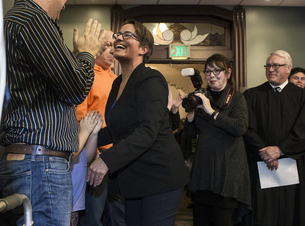 Cassie Franklin is greeted by family after she was sworn in as the mayor of Everett before a City Council meeting on Wednesday. (Ian Terry / The Herald)
