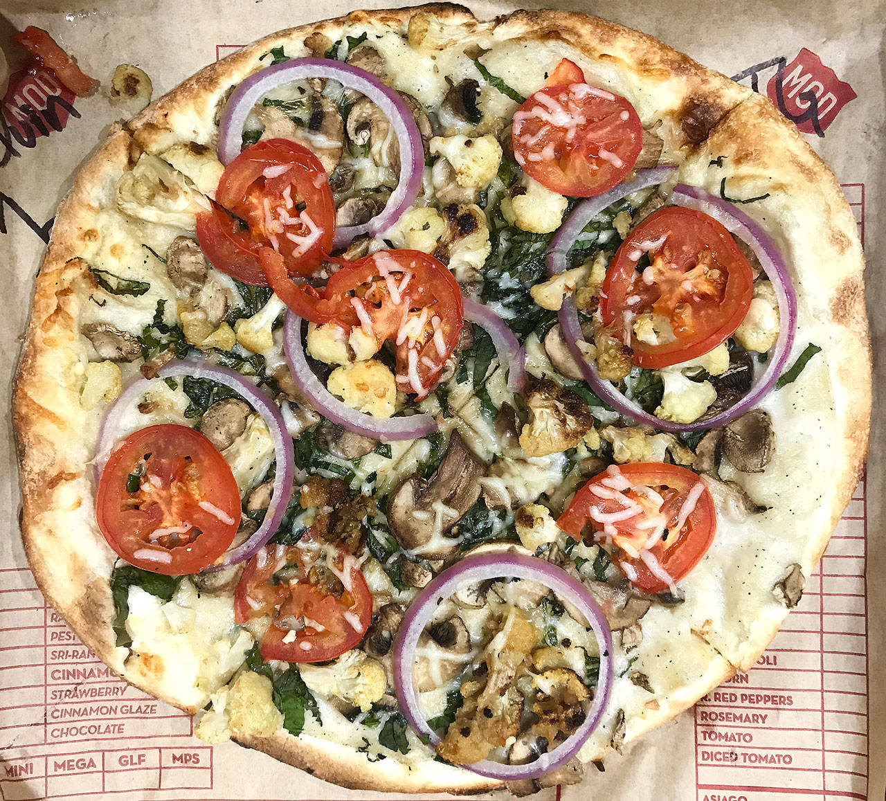 An 11-inch pizza with white sauce and vegetables from MOD Pizza is $8.27. (Andrea Brown/The Herald)