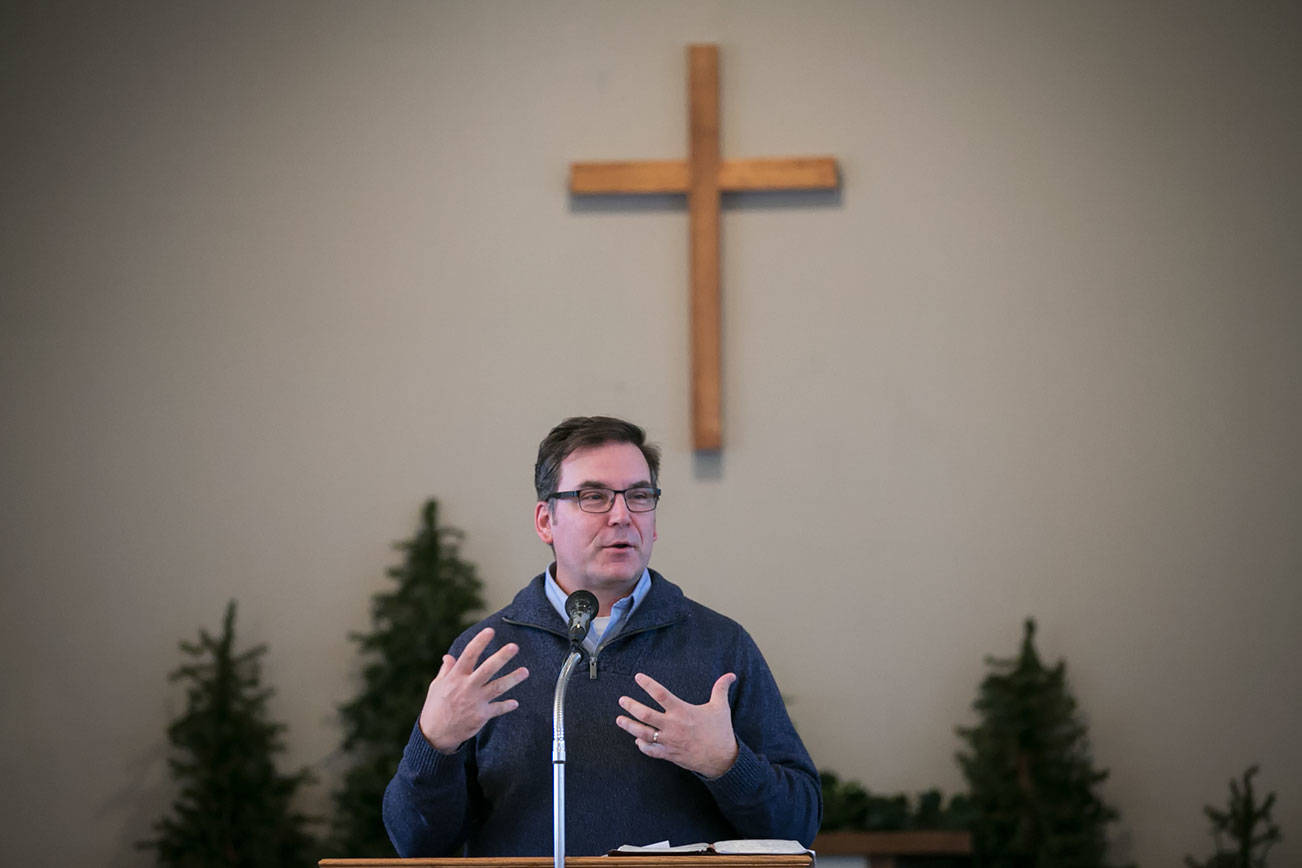 The Rev. Mark Kohls delivers his sermon Jan. 21 at North Creek Country Church in Bothell. (Kevin Clark / The Herald)