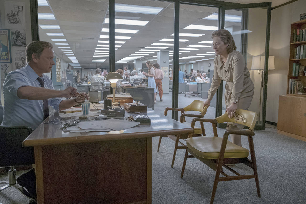 Washington Post Executive Editor Ben Bradlee (Tom Hanks) and publisher Katharine Graham (Meryl Streep) confer in the paper’s newsroom in “The Post.” (20th Century Fox)