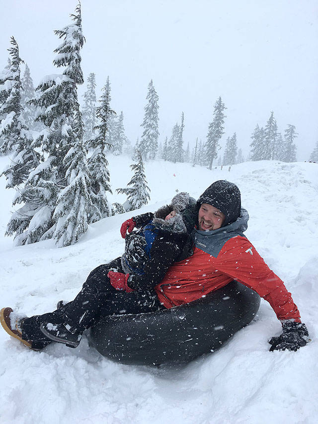 The author and his son Teddie, 4, prepare to go down a sledding run during a recent visit to Mount Baker. (Aaron Swaney)