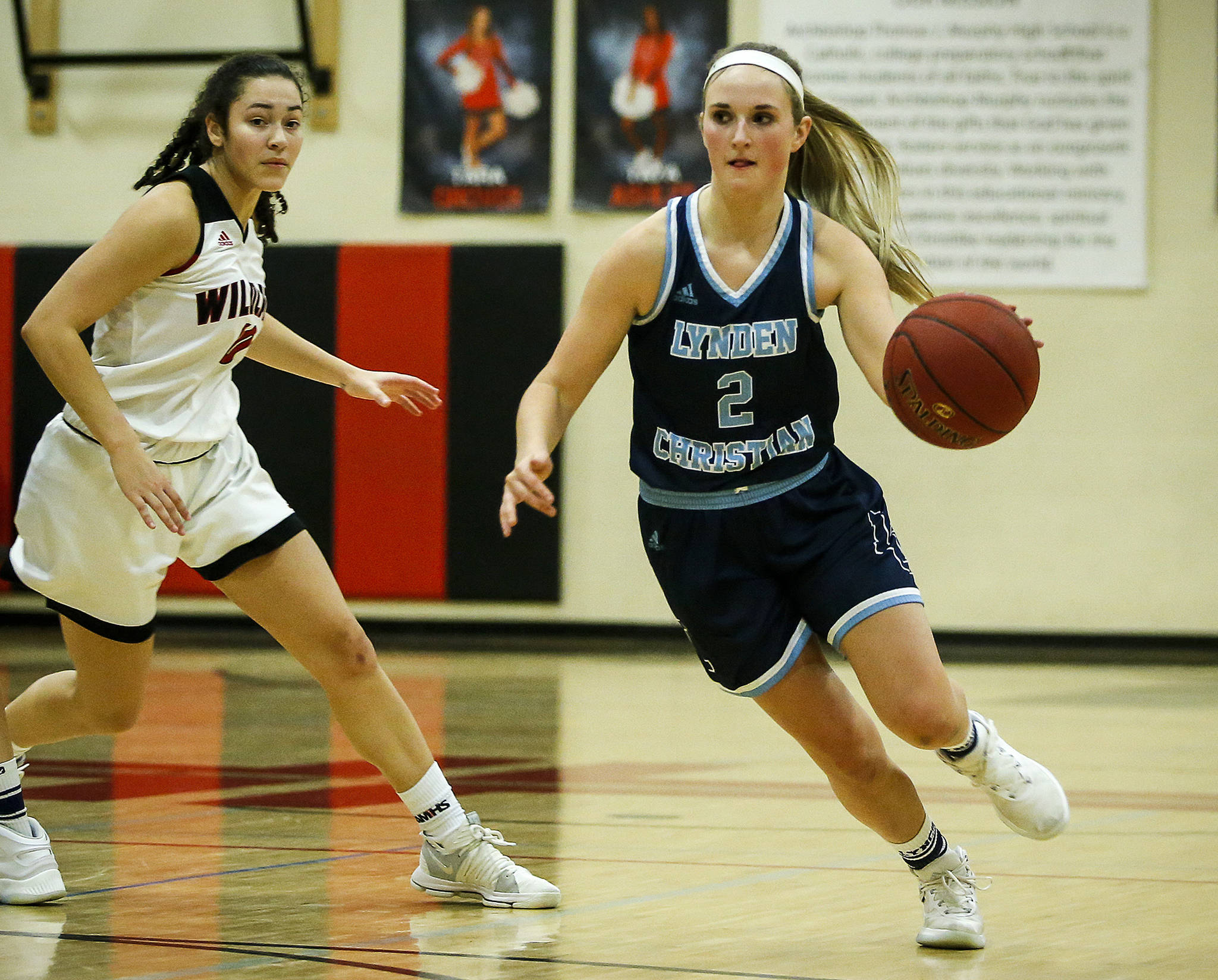 Lynden Christian’s Josie Bocci dribbles through the Archbishop Murphy defense in the Lyncs’ 44-31 win over the Wildcats on Thursday in Everett. (Ian Terry / The Herald)