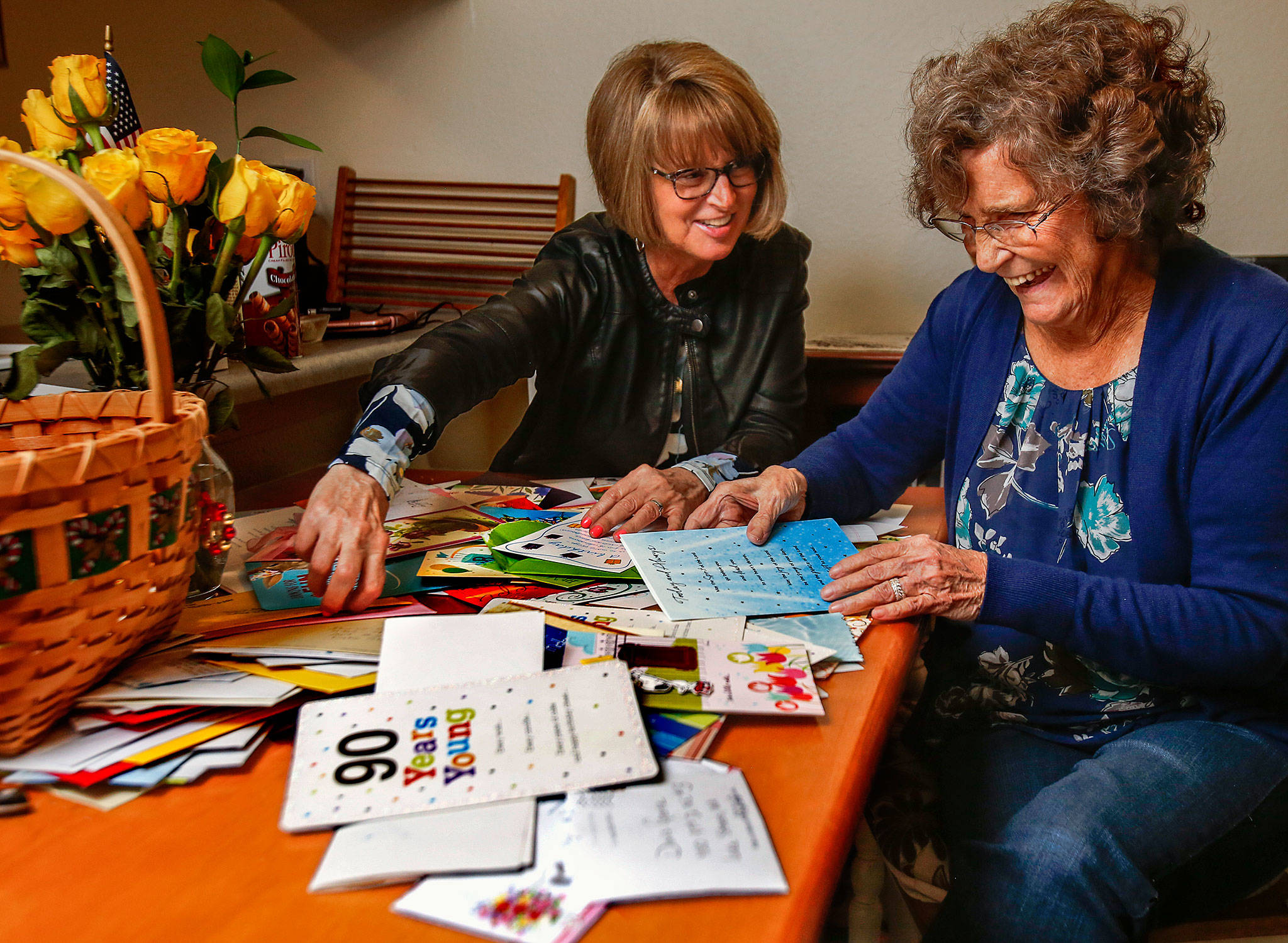 On her 90th birthday Monday, Doris Goertz of Lake Stevens and her daughter, Rachel O’Brien, read some pretty hilarious notes as they go through some of the 186 or so letters and cards Goertz recieved after O’Brien recruited friends to send them snail mail instead of email. (Dan Bates / The Herald)
