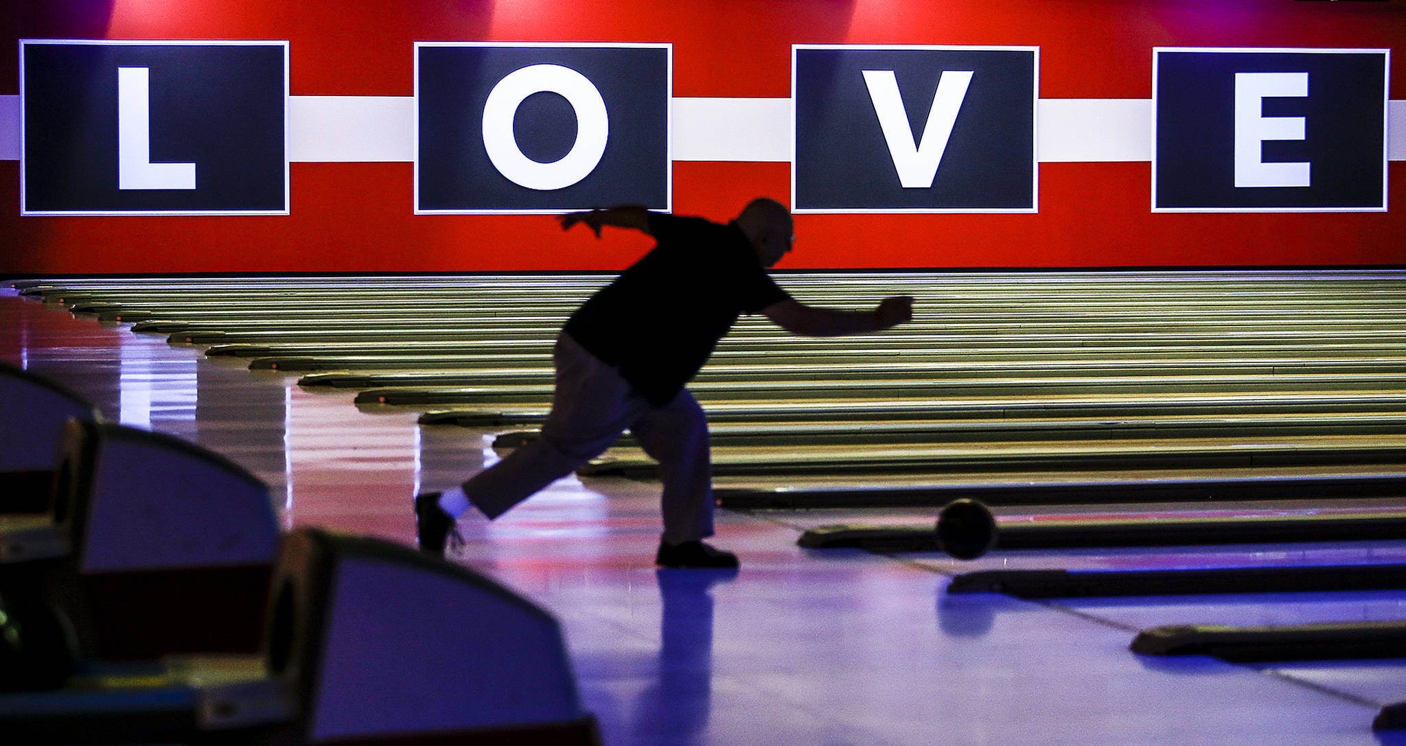 A bowler throws at newly opened Bowlero in Lynnwood. (Ian Terry / The Herald)