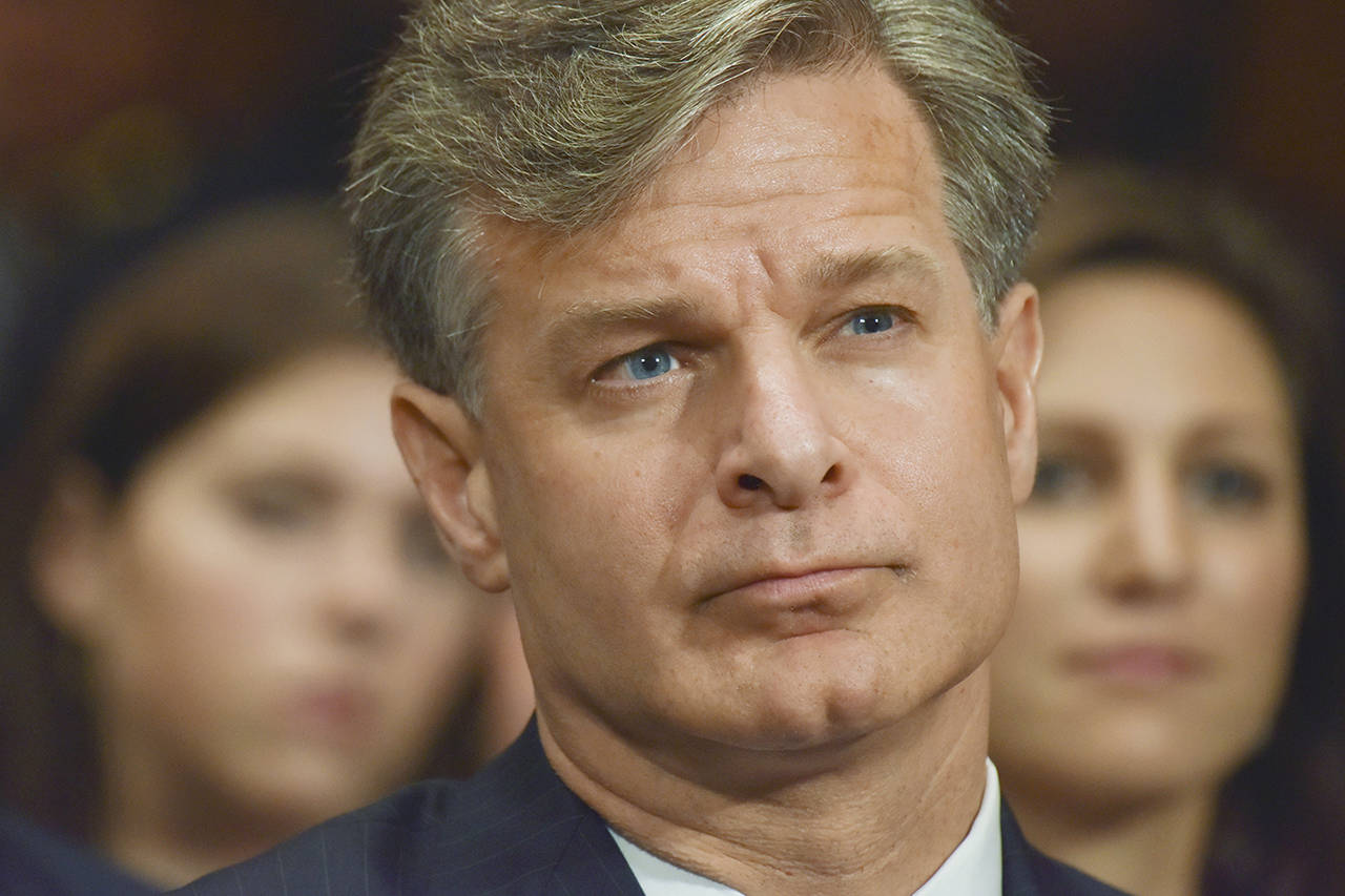 On Friday, FBI Director Christopher Wray sent a video message to those he leads, urging them to “keep calm and tackle hard.” (Jahi Chikwendiu/The Washington Post)