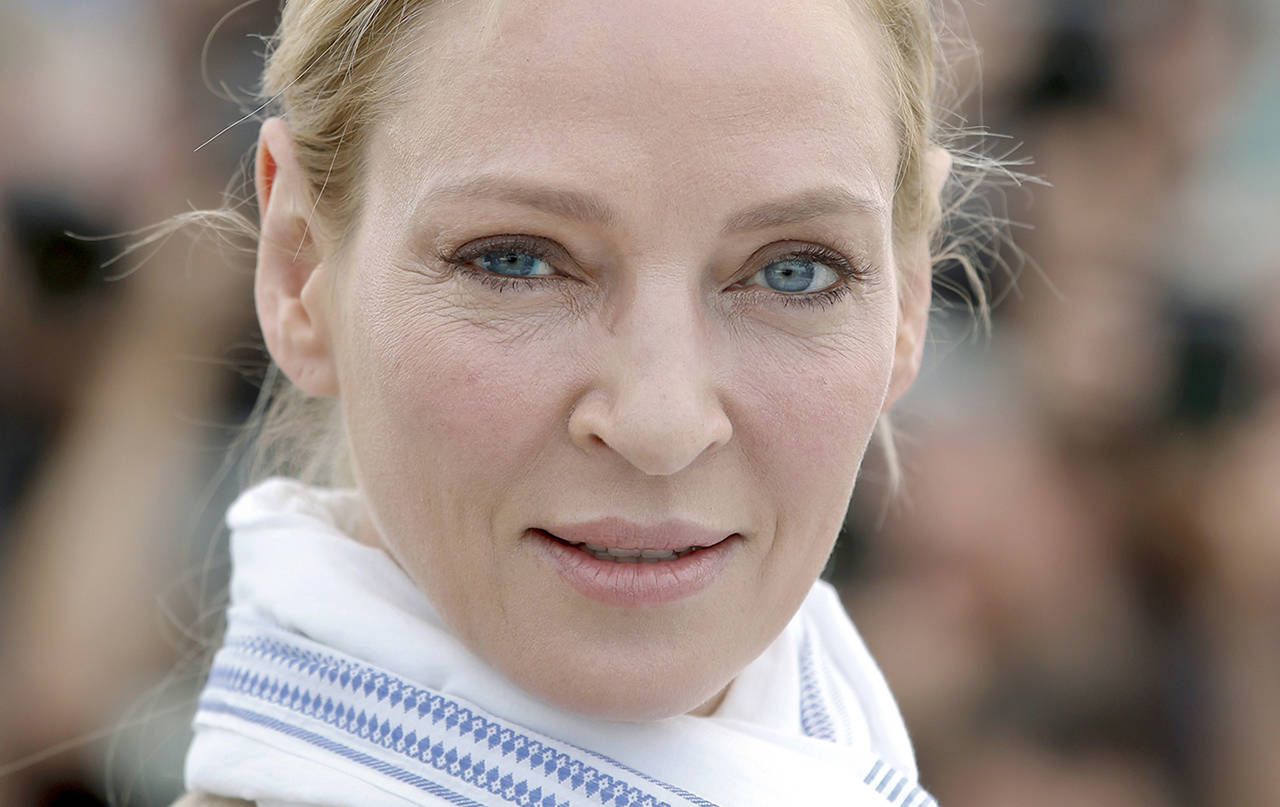 Actress Uma Thurman has accused embattled Hollywood producer Harvey Weinstein of forcing himself upon her sexually and director Quentin Tarantino of making her perform a dangerous car stunt that injured her. (AP Photo/Alastair Grant)