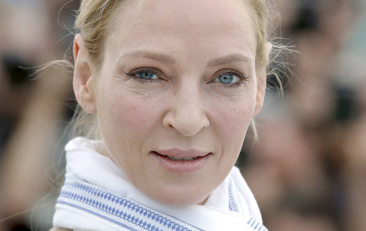 Actress Uma Thurman has accused embattled Hollywood producer Harvey Weinstein of forcing himself upon her sexually and director Quentin Tarantino of making her perform a dangerous car stunt that injured her. (AP Photo/Alastair Grant)