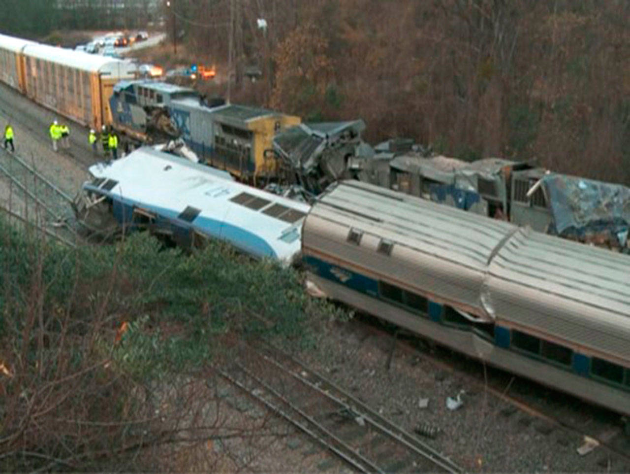 In this image from video, train cars are smashed and derailed Sunday, Feb. 4, 2018 near Cayce. S.C. The crash left multiple people dead and dozens of people injured. (WLTX TV via AP)