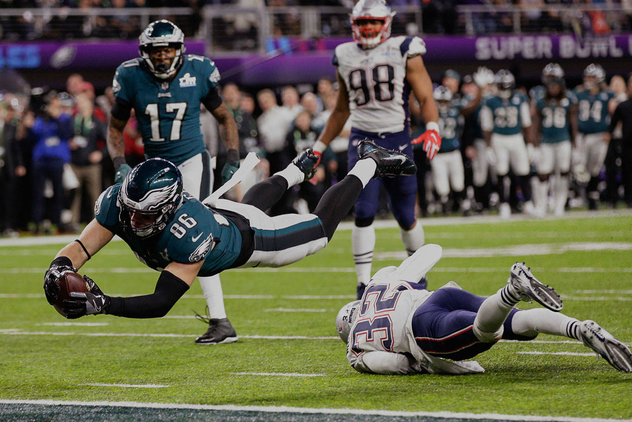 Philadelphia Eagles tight end Zach Ertz (86) dives into the end zone over New England Patriots free safety Devin McCourty (32) for a touchdown in the fourth quarter of Super Bowl 52 in Minneapolis. (AP Photo/Frank Franklin II)