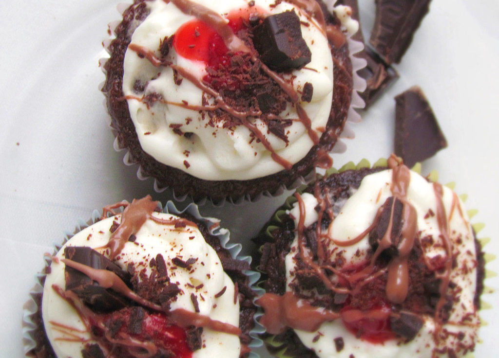 The recipe for mini black forest cakes combines the flavors of chocolate, cherries and cream.
