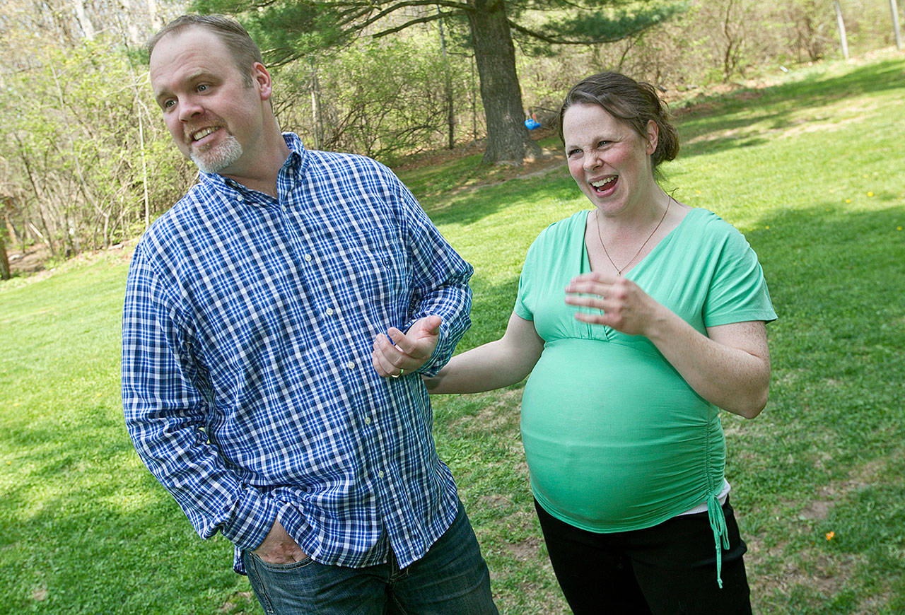 Kateri and Jay Schwandt in 2015. They have 13 boys and are expecting their 14th child in April. (Chris Clark/The Grand Rapids Press via AP, File)