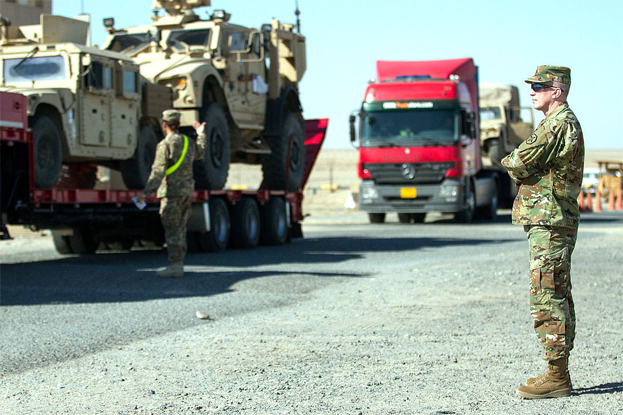 Brig. Gen. Gregory Mosser, commanding general of Marysville-based 364th Expeditionary Sustainment Command, observes transloading operations at Khabari Crossing on the Kuwait-Iraq border on Feb. 4 during Joint Monthly Access for Reserve Component (JMARC), a quarterly opportunity for senior leaders from the U.S. Army National Guard and Reserve to visit with deployed Soldiers. The JMARC provided the opportunity to reserve leaders to understand the deployed mission to ensure future units are prepared, through proper manning, equipping, and training, for their missions in the USCENTCOM AOR (U.S. Army photo by Sgt. Thomas X. Crough)