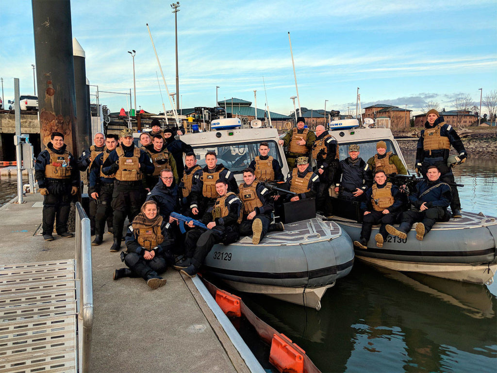 Members of U.S. Coast Guard Port Security Unit 313 in Everett relax after finishing night tactic training on Feb. 11. (Petty Officer 1st Class Robert Kroll / U.S. Coast Guard)
