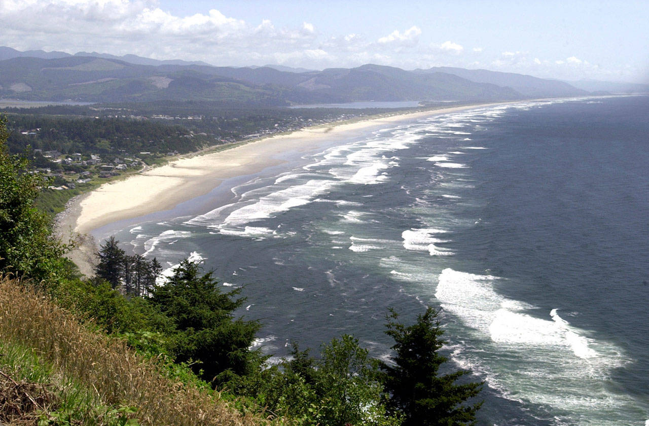 An expanse of beach near Rockaway, Oregon, is shown from Nea-kah-nie Mountain. State officials and members of the congressional delegations from Washington and Oregon have protested a Trump administration proposal to consider an offshore drilling lease in those states’ waters. (Don Ryan/Associated Press file photo)