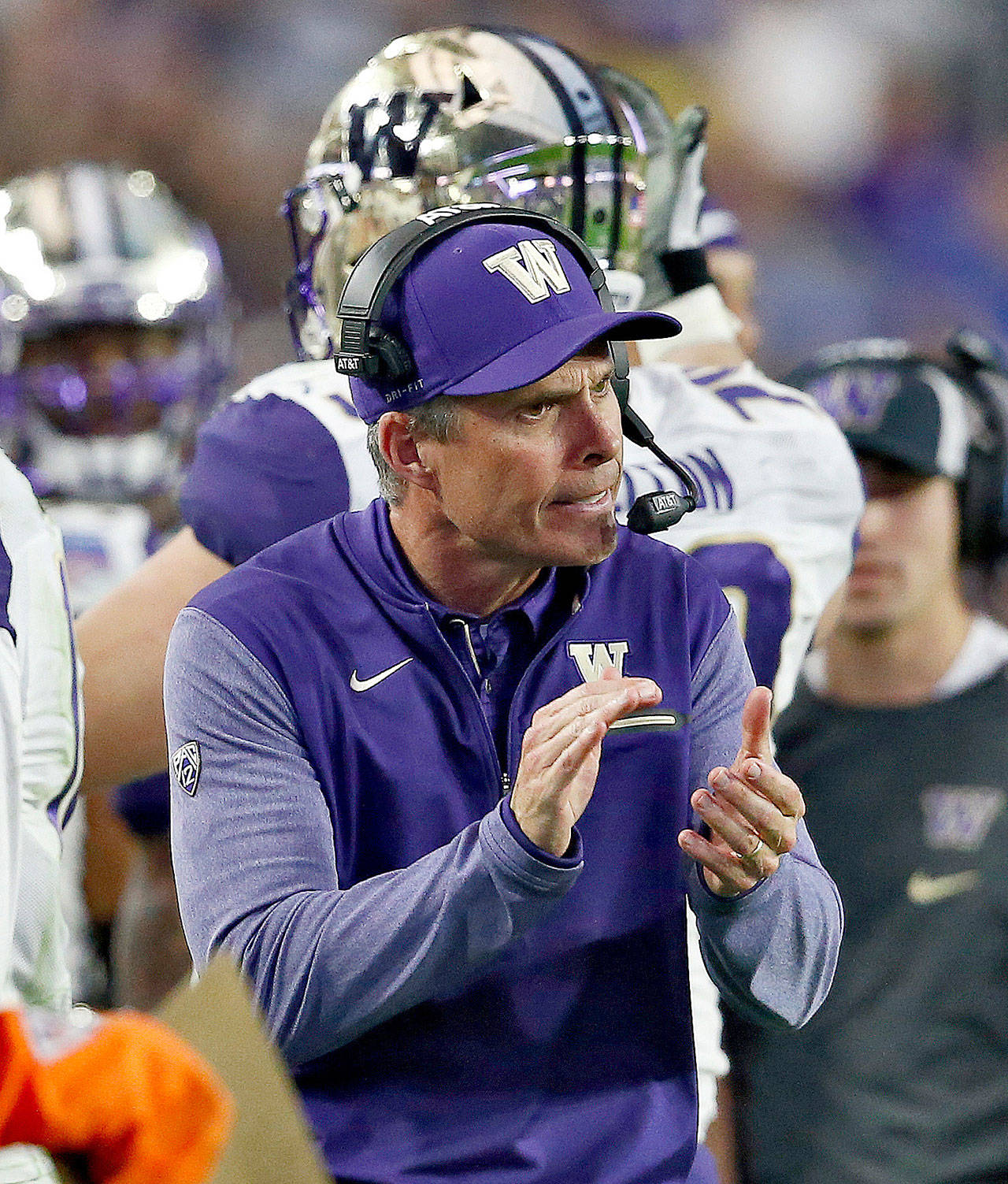 Washington football coach Chris Petersen applauds on the sideline during the Huskies Fiesta Bowl loss to Penn State on Dec. 30, 2017 in Glendale, Ariz. Petersen and the Huskies have brought in a banner recruiting class for next season. (AP Photo/Ross D. Franklin)