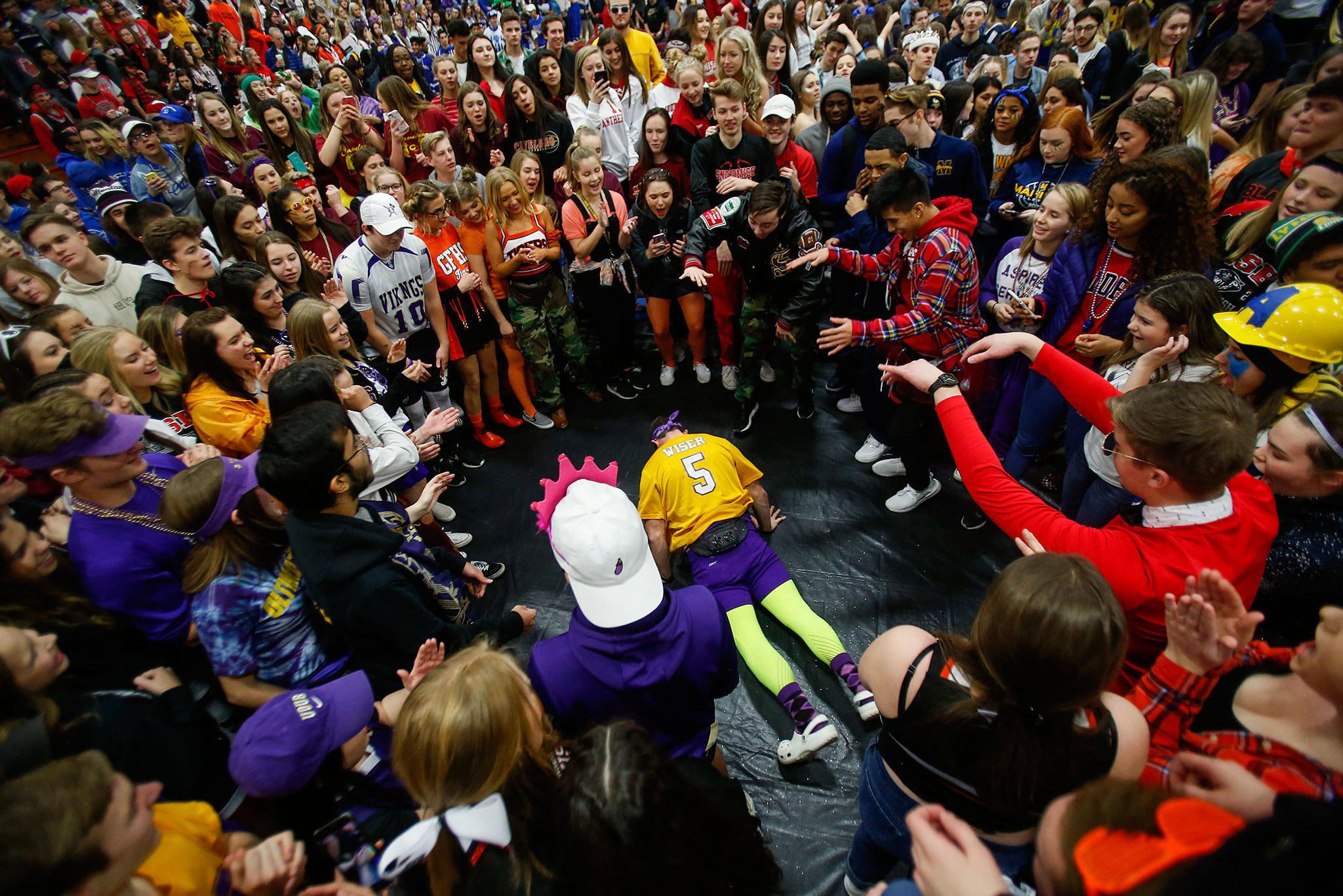 In front of a stage in the Marysville Pilchuck High School gymnasium Tuesday, students surround others who show off some dancing skills for the crowd. MPHS was hosting Interhigh for more than three dozen schools from around the region. Their theme was “Find Your Grind,” which was about identifying then pursuing your passion. (Dan Bates / The Herald)