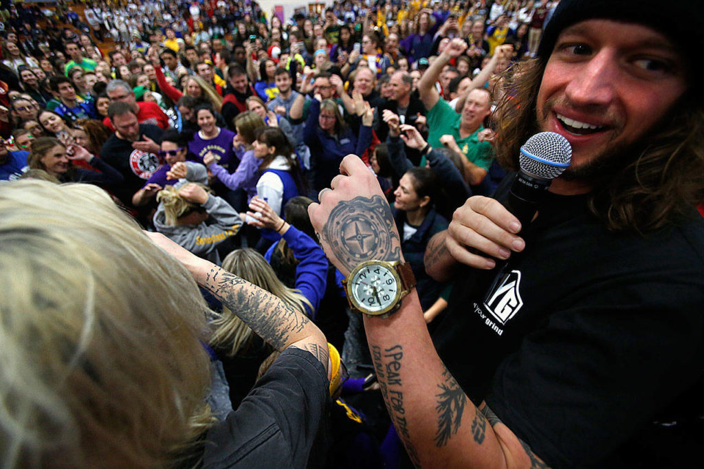 Speaker Mike Smith (right) and students convinced teachers and staff to come down to the floor and show the kids how it was done in their time. (Dan Bates / The Herald)
