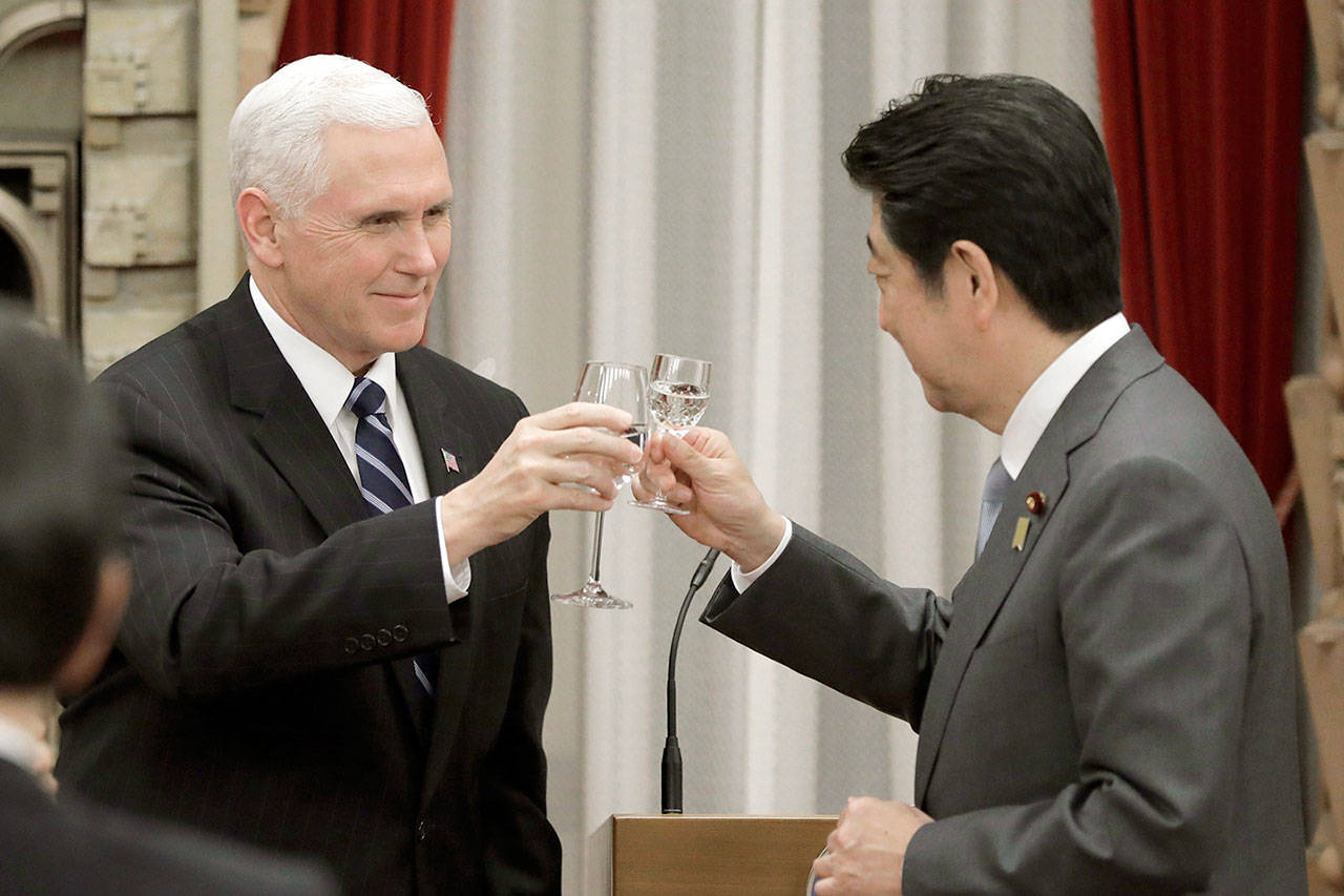 U.S. Vice President Mike Pence makes a toast with Japan’s Prime Minister Shinzo Abe during a banquet hosted by Abe at the prime minister’s official residence in Tokyo on Wednesday. (Kiyoshi Ota/Pool Photo via AP)
