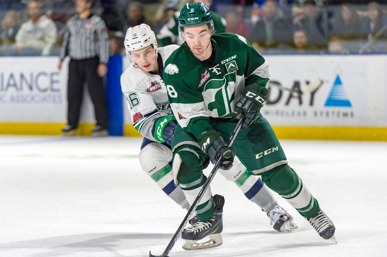 The Silvertips’ Patrick Bajkov (right) skates past the Thunderbirds’ Alexander True during a game on Jan. 27, 2018, at the ShoWare Center in Kent. (Brian Liesse / Seattle Thunderbirds)