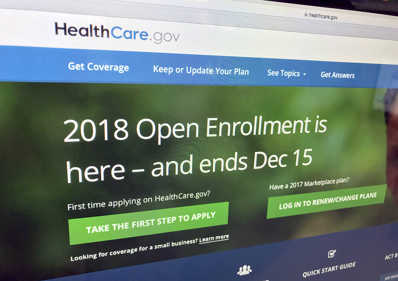 A new tally by The Associated Press finds that nearly 11.8 million Americans have signed up for coverage this year under former President Barack Obama’s health care law. (AP Photo/Jon Elswick