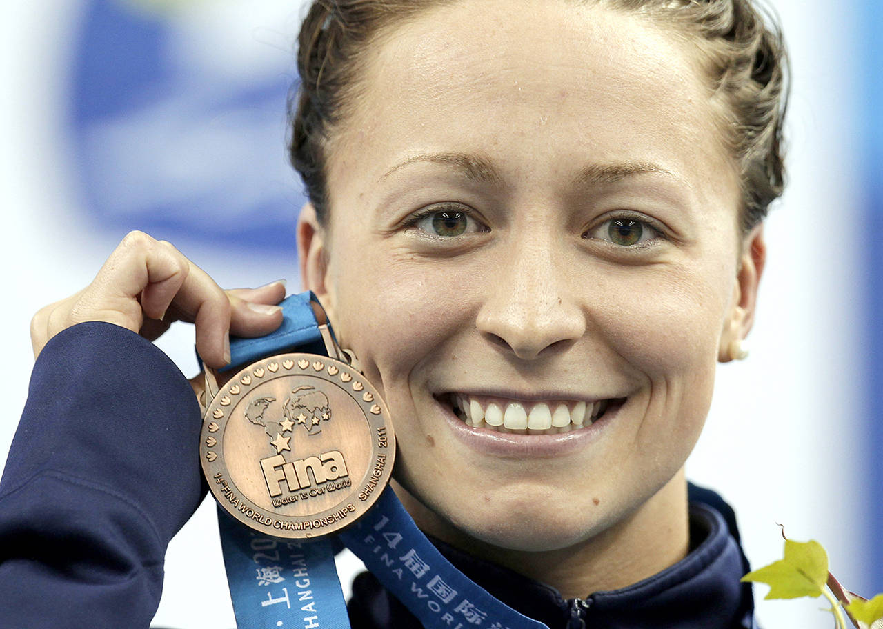 Ariana Kukors, of the United States, holds her bronze medal for the women’s 200-meter Individual Medley final at the FINA 2011 Swimming World Championships in Shanghai, China. The U.S. (AP Photo/Michael Sohn, File)