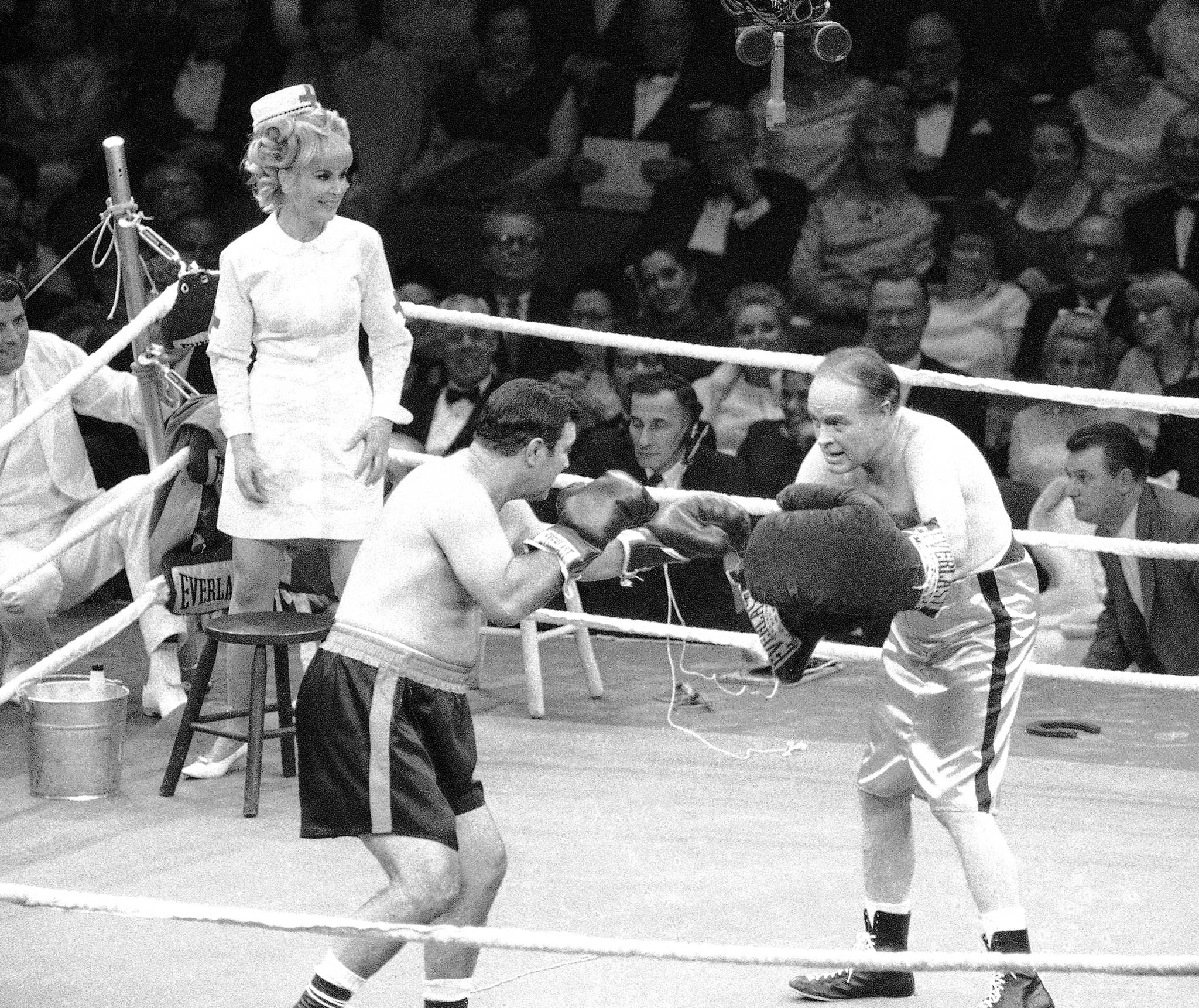Associated Press archive                                New York City’s fourth and current Madison Square Garden opened on Feb. 11, 1968, with funnyman Bob Hope staging a mock battle with former heavyweight champion Rocky Marciano as a part of a benefit for the USO, co-hosted by Hope and Bing Crosby. Clad in a nurse costume, actress Barbara Eden watches Hope play pat-a-cake with the retired boxer.