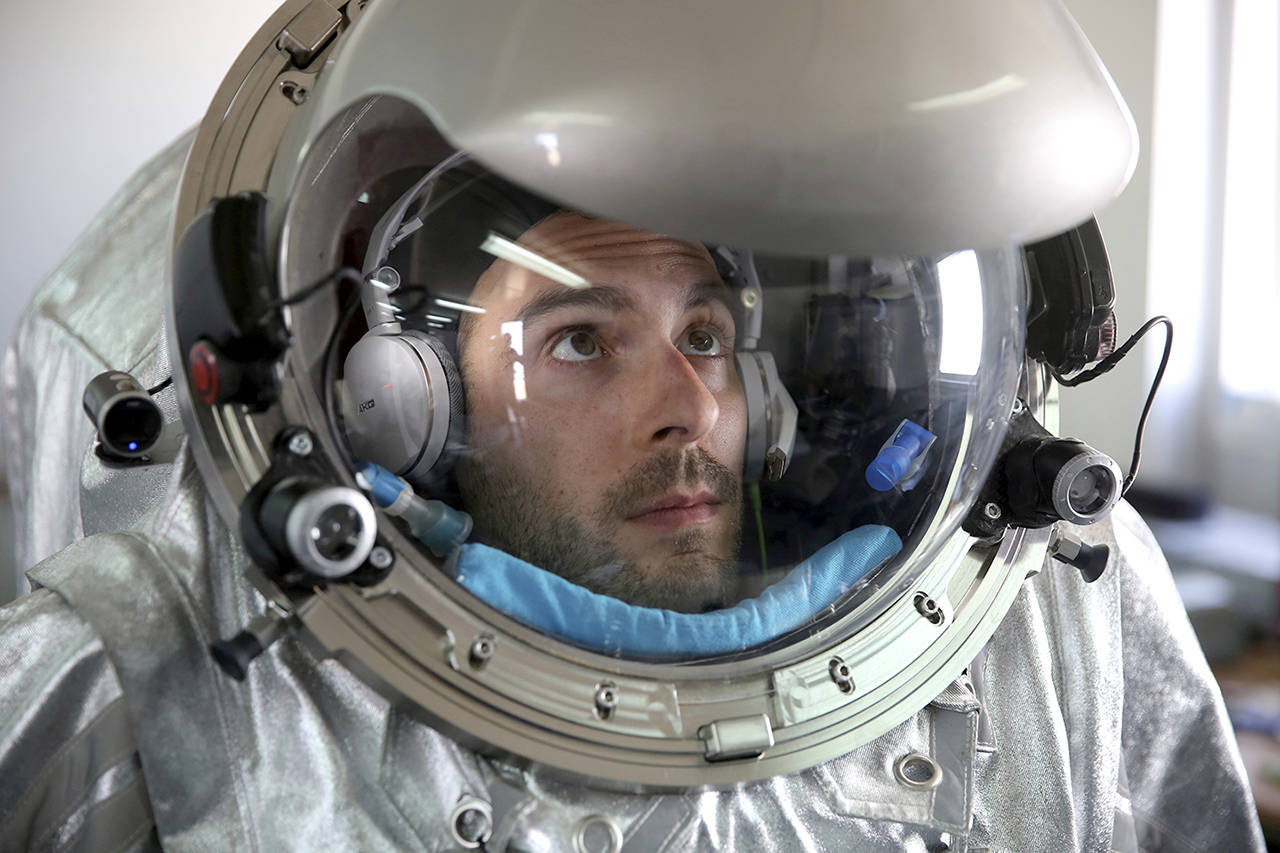 João Lousada, a flight controller for the International Space Station, wears an experimental space suit during a simulation of a future Mars mission in the Dhofar desert of southern Oman. (AP Photo/Sam McNeil)