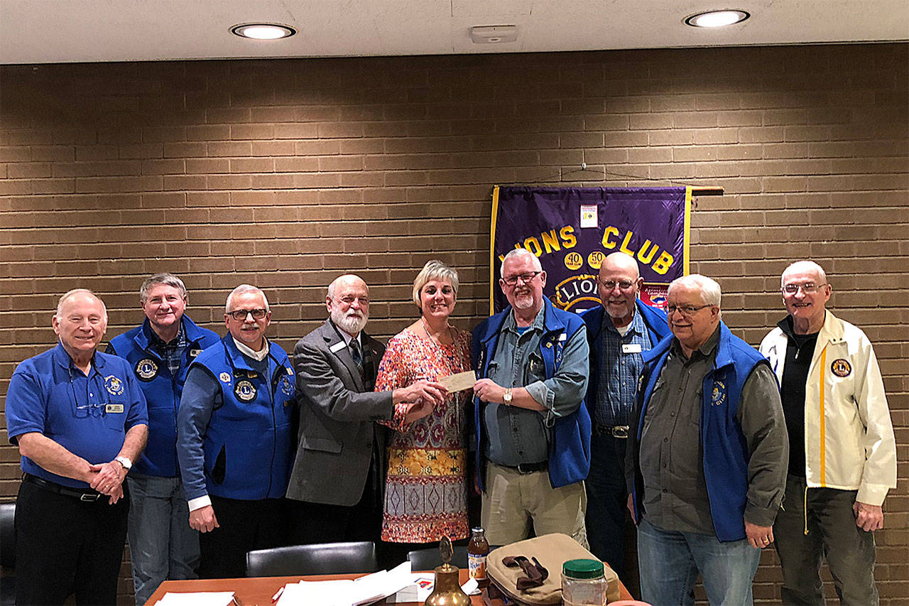 The Edmonds Lions Club on Jan. 22 donated $5,400 to the Edmonds Food Bank. (Contributed photo)